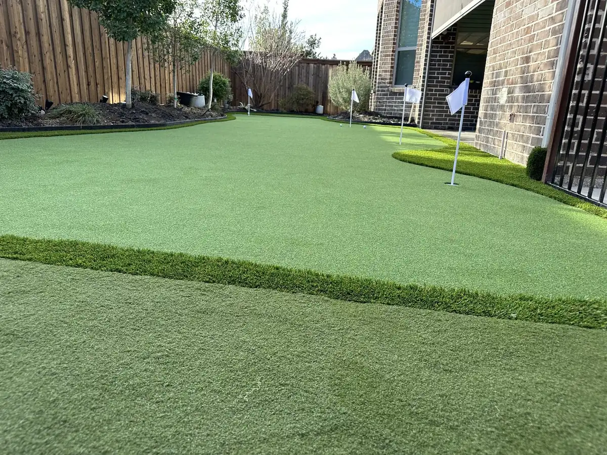 Close-up of clean artificial turf fibers with infill